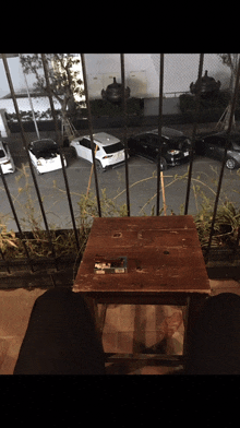 a small wooden table with a cigarette on it