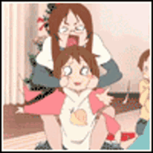 a woman is carrying a little girl on her shoulders .