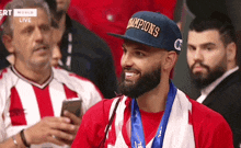 a man wearing a hat that says " champions " on it