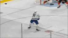 a hockey game is being played in front of an advertisement for jack daniel 's