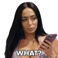 a woman holding a cell phone with the words what written on her face