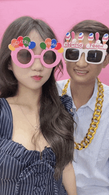 a man and a woman wearing sunglasses that say yaarh on them
