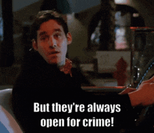 a man sitting in a car with the words " but they 're always open for crime "