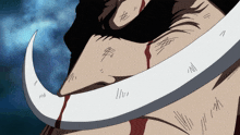 a close up of a man 's face with blood coming from his mouth