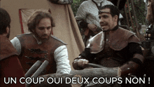 a man in armor is sitting next to another man with the words " un coup oui deux coups non " above him