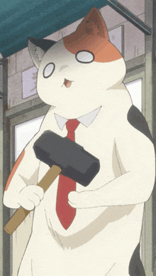 a cat with a red tie is holding a large black hammer