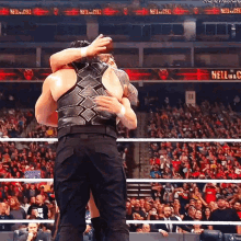 Roman Reigns Daniel Bryan GIF - Roman Reigns Daniel Bryan Hug GIFs