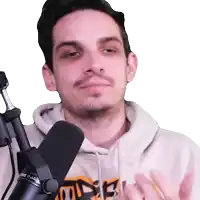 a man standing in front of a microphone with a hoodie that says ' nsf ' on it