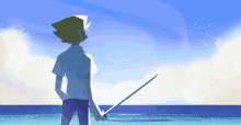 a man is standing on the beach holding a sword