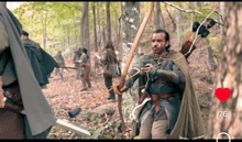 a man is holding a bow and arrow in the woods with a heart in the background