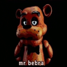 a close up of a teddy bear with a bow tie and the words `` mr bebra '' .