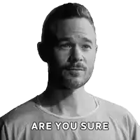 a man with a beard is wearing a shirt that says " are you sure " on it