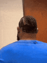 the back of a man 's head with a shaved design on it