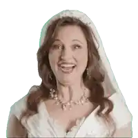 a woman in a wedding dress with a veil on her head is smiling