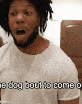 a man with dreadlocks is wearing a white t-shirt that says the dog bout to come on .