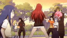 a group of people are standing around a woman with red hair
