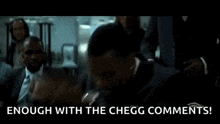 a man in a suit and tie is sitting in front of a group of people and says `` enough with the chegg comments ! ''
