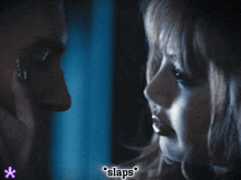 a man and a woman are looking at each other and the word slaps is on the bottom right