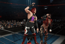 two wrestlers in a ring with one wearing a tank top that says what 's up weapon
