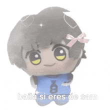 a stuffed toy with a pink bow and the words baila si eres de sam written below it