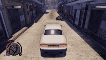 a car with a license plate that says hk39tsj is driving down a street