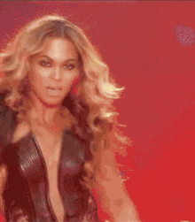 a woman with blonde hair is dancing on a stage .