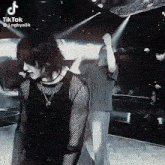 a man and a woman are dancing on a stage .