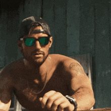 a shirtless man is wearing sunglasses and a hat