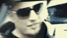 a close up of a person wearing sunglasses with a watermark that says ' the view '