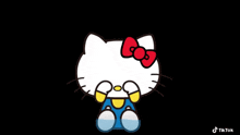 hello kitty with a red bow on her head