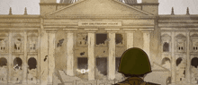 a soldier stands in front of a dem deutschen volke building