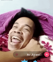 a man laying on a bed with his tongue hanging out and the name mr.ayawco