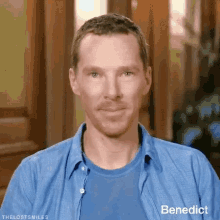 a man wearing a blue shirt with benedict written on the bottom