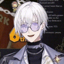 a man with white hair and purple glasses is wearing a black turtleneck .
