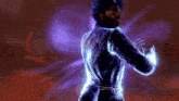 a man with a beard is standing in a dark room with purple lights behind him