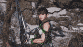 a girl in a video game holding a sword