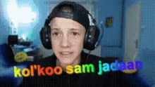 a pixelated image of a boy wearing headphones that says kol ' koo sam jaddan