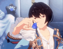 a boy in a blue jacket is holding a blue pendant in his hand