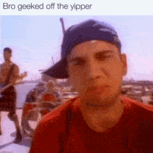 a man wearing a baseball cap and a red shirt is looking at the camera with the caption bro geeked off the yipper .