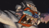 a close up of a cartoon character with a very large mouth and sharp teeth .