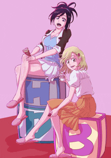 a cartoon drawing of two girls sitting on a block with the letter b on it