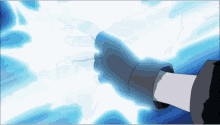 a person 's hand is reaching out towards a white light
