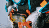 a close up of a person holding a toy that says ' a ' on it