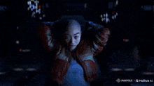 a blurred image of a person standing in front of a computer screen with the words minimax on the bottom