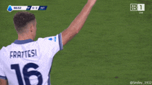 a soccer player wearing a number 16 jersey stands on the field