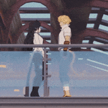 a man and a woman are standing on a balcony talking to each other