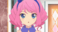 a girl with pink hair and blue eyes is wearing a blue collar
