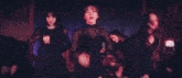 a woman with red hair is dancing on a stage