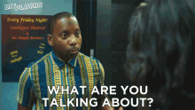 a man is talking to a woman with the words what are you talking about