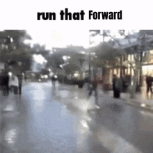 a blurry picture of a city street with the words `` run that forward '' written above it .